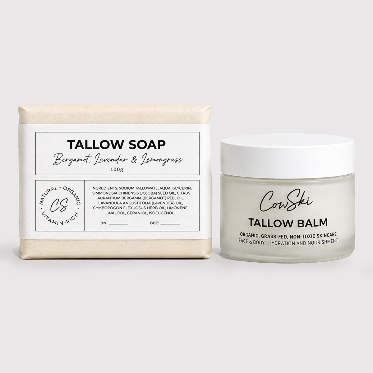 A bar of Tallow Soap and a jar of CowSki Tallow Balm displayed side by side on a light gray background. The soap bar has a cream-colored wrapper with a white label, and the balm is in a frosted glass jar with a white lid.